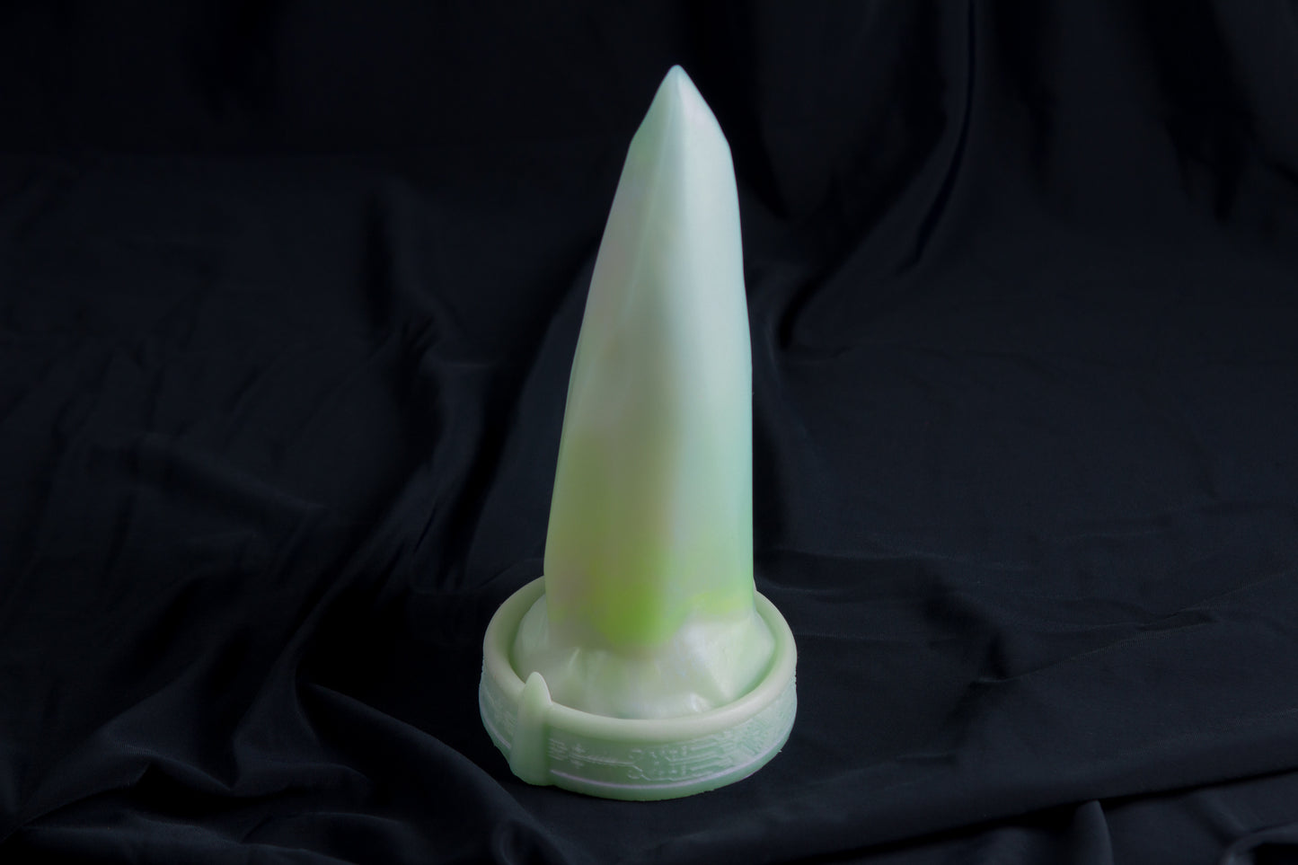 Medium Bloomstone in glow in the dark white quartz color, soft firmness, with suction cup base