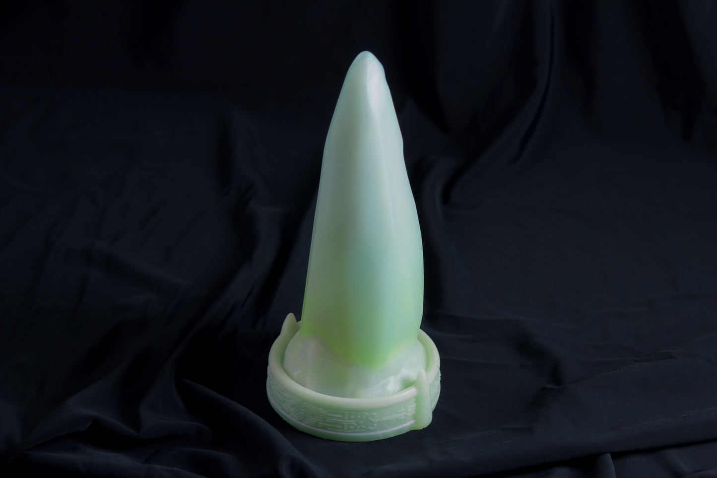 Medium Bloomstone in glow in the dark white quartz color, soft firmness, with suction cup base