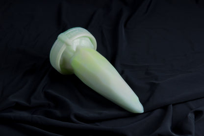 Medium Bloomstone in glow in the dark white quartz color, soft firmness, with suction cup base