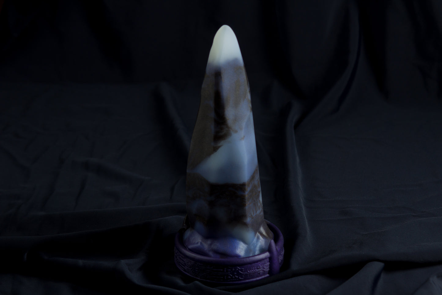 Medium Bloomstone in glow in the dark black marble color, soft firmness, with suction cup base