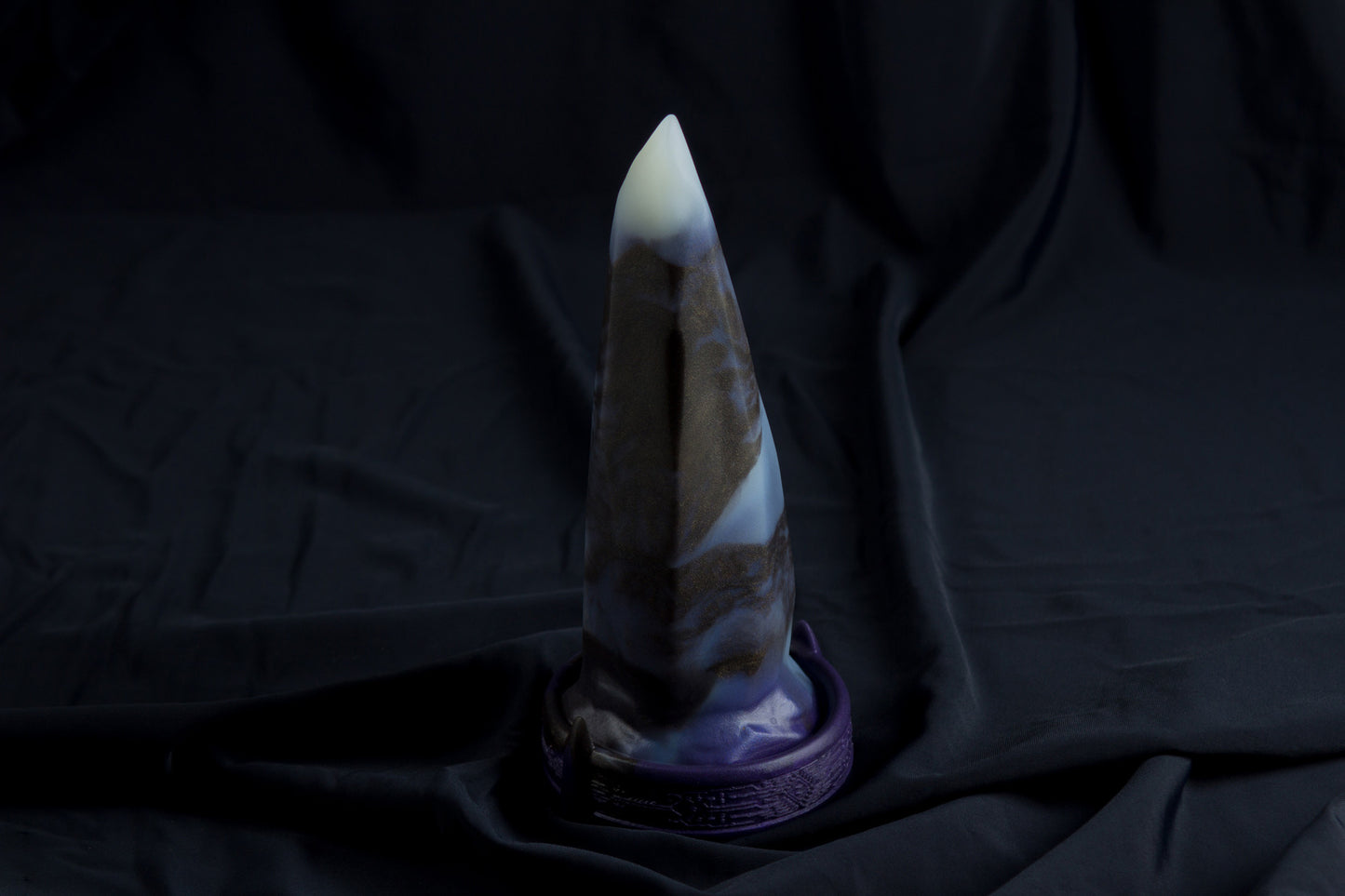 Medium Bloomstone in glow in the dark black marble color, soft firmness, with suction cup base