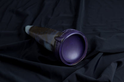 Medium Bloomstone in glow in the dark black marble color, soft firmness, with suction cup base